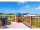 Deck features a playhouse and a grill at 36023 Winchester Rd, Elizabeth, CO 80107