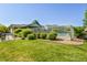 Community pool with surrounding lawn and fence at 13042 Grant E Cir # C, Thornton, CO 80241