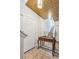 Bright entryway with mirror, console table, and staircase leading upstairs at 13042 Grant E Cir # C, Thornton, CO 80241