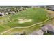 Aerial view of golf course with surrounding houses at 13042 Grant E Cir # C, Thornton, CO 80241