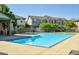 Community pool with plenty of lounge chairs and seating at 13042 Grant E Cir # C, Thornton, CO 80241