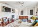 Living room with hardwood floors, fireplace, and built-in shelving at 13042 Grant E Cir # C, Thornton, CO 80241