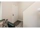 Simple entryway with a white door, gray floor, and small rug at 7978 Chase Cir # E, Arvada, CO 80003