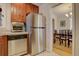 Kitchen with stainless steel appliances and wood cabinets at 2812 Krameria St, Denver, CO 80207