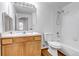 Clean bathroom with light wood vanity, shower/tub combo at 5726 N Genoa Way # 10-106, Aurora, CO 80019