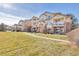 Two-story building with balconies and lawn at 5726 N Genoa Way # 10-106, Aurora, CO 80019