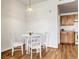 Bright dining area with a round table and four chairs at 5726 N Genoa Way # 10-106, Aurora, CO 80019