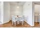 Small dining area with white table and chairs, laundry access at 5726 N Genoa Way # 10-106, Aurora, CO 80019
