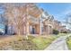 Brick building exterior with a private patio at 5726 N Genoa Way # 10-106, Aurora, CO 80019