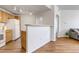 Kitchen with light wood cabinets, white appliances, and a breakfast bar at 5726 N Genoa Way # 10-106, Aurora, CO 80019