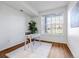 Home office with desk, chair, and large window at 5726 N Genoa Way # 10-106, Aurora, CO 80019