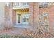 Private patio with brick wall and ground-level access at 5726 N Genoa Way # 10-106, Aurora, CO 80019
