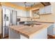 Kitchen with stainless steel appliances and butcher block countertops at 32155 Edward Dr, Conifer, CO 80433