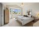 Main bedroom with bay window, ceiling fan, and ample natural light at 23038 E River Chase Way, Parker, CO 80138