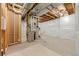 Unfinished basement with HVAC and plumbing at 5049 Liverpool St, Denver, CO 80249