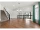 Elegant dining room with hardwood floors and chandelier at 5049 Liverpool St, Denver, CO 80249