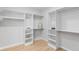 Spacious walk-in closet with plenty of storage space and built-in shelving at 8145 W 22Nd Ave, Lakewood, CO 80214