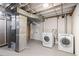 Laundry room with washer, dryer, and mechanicals at 8145 W 22Nd Ave, Lakewood, CO 80214