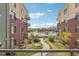 Courtyard view with walking path and landscaping at 3601 Arapahoe Ave # 226, Boulder, CO 80303