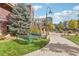 Pathway through landscaped courtyard with benches at 3601 Arapahoe Ave # 226, Boulder, CO 80303