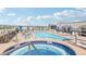 Rooftop hot tub with pool and lounge chairs at 3601 Arapahoe Ave # 226, Boulder, CO 80303