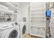 Laundry room with washer, dryer, shelving and storage at 3601 Arapahoe Ave # 226, Boulder, CO 80303