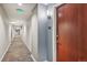 Clean and well-lit hallway with wood floors at 3601 Arapahoe Ave # 226, Boulder, CO 80303