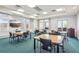 Bright meeting room with tables and chairs at 3601 Arapahoe Ave # 226, Boulder, CO 80303