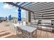 Community BBQ area with seating and mountain views at 3601 Arapahoe Ave # 226, Boulder, CO 80303