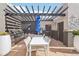 Outdoor grilling area with pergola, tables, and chairs at 3601 Arapahoe Ave # 226, Boulder, CO 80303