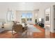 Living room with access to balcony and hardwood floors at 3601 Arapahoe Ave # 226, Boulder, CO 80303