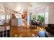 Bright dining room with hardwood floors and view to the kitchen at 2386 Creek Valley Cir, Monument, CO 80132