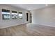 Bright and airy living room with hardwood floors and large windows at 16728 W 93Rd Pl, Arvada, CO 80007