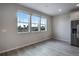 Spacious dining area with large windows offering natural light at 16728 W 93Rd Pl, Arvada, CO 80007