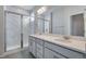 Double vanity bathroom with large mirror and shower at 16728 W 93Rd Pl, Arvada, CO 80007