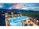 Aerial view of community pool at dusk at 16728 W 93Rd Pl, Arvada, CO 80007