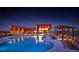 Night view of resort-style pool with seating and a pergola at 16728 W 93Rd Pl, Arvada, CO 80007