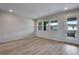 Spacious living room with hardwood floors and access to balcony at 16728 W 93Rd Pl, Arvada, CO 80007