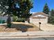 Ranch style home with attached garage and basketball hoop at 3581 S Olathe St, Aurora, CO 80013