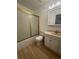 Clean bathroom with shower/tub combo and white vanity at 3581 S Olathe St, Aurora, CO 80013