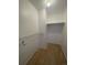 Large walk-in closet with wire shelving and wood-look floors at 3581 S Olathe St, Aurora, CO 80013