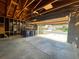 Spacious garage with open door, view of street, and storage shelves at 3581 S Olathe St, Aurora, CO 80013
