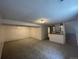 Finished basement with grey carpet and wet bar at 3581 S Olathe St, Aurora, CO 80013