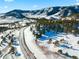 Aerial view of snowy lot and mountain range at 63 Canyon Pines Dr, Arvada, CO 80403