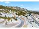 Aerial view of snowy lot near mountain at 63 Canyon Pines Dr, Arvada, CO 80403