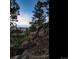 View from rocky mountain top, overlooking plains at 63 Canyon Pines Dr, Arvada, CO 80403