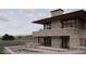 Modern home with stone accents, pool, and mountain views at 63 Canyon Pines Dr, Arvada, CO 80403