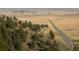 Hillside view with road and distant city at 63 Canyon Pines Dr, Arvada, CO 80403
