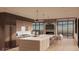 Modern kitchen with island, marble countertops, and stainless steel appliances at 63 Canyon Pines Dr, Arvada, CO 80403