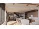 Modern kitchen with island, marble countertops, and stunning views at 63 Canyon Pines Dr, Arvada, CO 80403